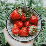 strawberries on stainless steel bowl